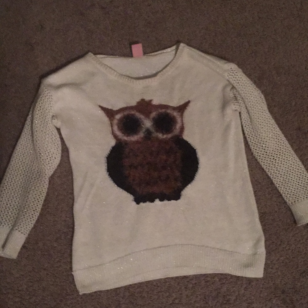 A white shirt with a owl on it